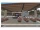 Pool pavilion with an outdoor kitchen, fireplace, and comfortable seating area, perfect for entertaining at 6228 N Cattle Track Rd, Scottsdale, AZ 85250