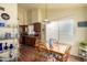 Cozy dining area next to the kitchen featuring a table and chairs with window views at 7302 W Meadowbrook Ave, Phoenix, AZ 85033