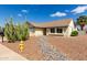 Landscaped home featuring desert-style yard with gravel, rocks and a yellow fire hydrant at 7302 W Meadowbrook Ave, Phoenix, AZ 85033