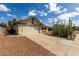 Charming home with two-car garage, desert landscaping and front yard fire hydrant at 7302 W Meadowbrook Ave, Phoenix, AZ 85033