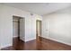 A bedroom featuring hardwood floors with multiple access points for optimal functionality at 750 E Northern Ave # 1089, Phoenix, AZ 85020
