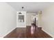 Bright living room featuring hardwood floors, modern lighting, and views of the kitchen at 750 E Northern Ave # 1089, Phoenix, AZ 85020