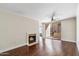 Cozy living room featuring a fireplace and sliding glass door to the patio at 750 E Northern Ave # 1089, Phoenix, AZ 85020