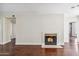 Hardwood floors throughout the open-concept living room and a cozy fireplace at 750 E Northern Ave # 1089, Phoenix, AZ 85020