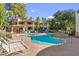 Community pool with lounge chairs, a gazebo, and nearby apartment buildings at 750 E Northern Ave # 1089, Phoenix, AZ 85020