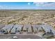 Stunning aerial view showcasing luxury homes and desert landscape, complemented by distant mountains under a blue sky at 8021 E Jasmine St, Mesa, AZ 85207