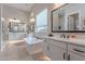 Luxurious bathroom featuring a soaking tub, double vanities, and modern fixtures at 8021 E Jasmine St, Mesa, AZ 85207