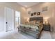 Beautiful bedroom showcasing a bed with a decorative patchwork quilt and ensuite bathroom access at 8021 E Jasmine St, Mesa, AZ 85207