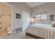 Relaxing bedroom with a comfortable bed, ensuite bathroom, and a large closet for ample storage at 8021 E Jasmine St, Mesa, AZ 85207