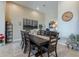 Formal dining room with seating for eight, complemented by tasteful decor and natural light at 8021 E Jasmine St, Mesa, AZ 85207