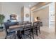 Formal dining room with seating for six, stylish furnishings and decor, and an inviting atmosphere at 8021 E Jasmine St, Mesa, AZ 85207