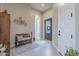 Charming entryway with a wood bench, decorative rug, and view to adjacent rooms at 8021 E Jasmine St, Mesa, AZ 85207