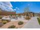 Cozy fire pit area with comfortable seating, landscaping, and an adjacent shaded pavilion, ideal for relaxation at 8021 E Jasmine St, Mesa, AZ 85207