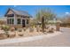 Charming guard house with brick accents, desert landscaping, and a secure gated entrance, offering privacy and security at 8021 E Jasmine St, Mesa, AZ 85207