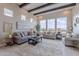 This spacious living room features large windows that provide ample natural light and views of the surrounding landscape at 8021 E Jasmine St, Mesa, AZ 85207