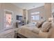 Inviting main bedroom with a cozy sitting area, and a door to the patio at 8021 E Jasmine St, Mesa, AZ 85207
