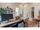 Home office space featuring a rustic desk, chair, and natural light at 8021 E Jasmine St, Mesa, AZ 85207