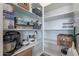 Walk-in pantry with shelving and storage for kitchen appliances and household goods at 8021 E Jasmine St, Mesa, AZ 85207