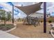 Modern playground structure with shade and seating, surrounded by landscaped gardens, perfect for Gathering fun at 8021 E Jasmine St, Mesa, AZ 85207