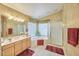 Bright bathroom with a soaking tub, and a large vanity with dual sinks at 8242 S Kachina Dr, Tempe, AZ 85284