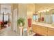 Bathroom with a large vanity with dual sinks, and an open-concept view to the bedroom at 8242 S Kachina Dr, Tempe, AZ 85284
