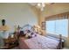 Comfortable bedroom with a ceiling fan, and a large window with natural light at 8242 S Kachina Dr, Tempe, AZ 85284