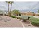 Charming single-story home featuring a well-manicured front yard, desert landscaping, and a two-car garage at 8242 S Kachina Dr, Tempe, AZ 85284