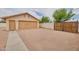 Detached two-car garage with spacious gravel driveway and gated access to the property at 8242 S Kachina Dr, Tempe, AZ 85284