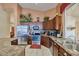 Well-equipped kitchen featuring stainless steel appliances, granite countertops, and ample cabinet space at 8242 S Kachina Dr, Tempe, AZ 85284