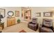 Comfortable living room with recliner seating, wood accents, neutral walls, and a ceiling fan at 8242 S Kachina Dr, Tempe, AZ 85284