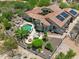 Aerial view of a home featuring pool, outdoor kitchen, manicured landscaping, and solar panels at 8540 E Mcdowell Rd # 10, Mesa, AZ 85207