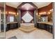 Luxurious bathroom showcasing a jetted tub, dual vanities, and elegant fixtures at 8540 E Mcdowell Rd # 10, Mesa, AZ 85207
