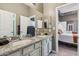 Bathroom featuring double sinks, granite countertops, and plenty of counter space at 8540 E Mcdowell Rd # 10, Mesa, AZ 85207