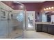 Modern bathroom with walk-in shower featuring glass blocks, tiled walls, and a built-in bench at 8540 E Mcdowell Rd # 10, Mesa, AZ 85207
