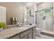 Contemporary bathroom features a granite countertop, stylish vanity, and a glass-enclosed shower at 8540 E Mcdowell Rd # 10, Mesa, AZ 85207