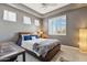 Comfortable bedroom featuring stylish decor, a cozy bed, and ample natural light at 8540 E Mcdowell Rd # 10, Mesa, AZ 85207