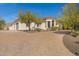 Well-maintained home featuring a circular driveway and mature desert landscaping at 8540 E Mcdowell Rd # 10, Mesa, AZ 85207