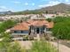 Stunning single-story home with a tile roof, desert landscaping, and a circular driveway at 8540 E Mcdowell Rd # 10, Mesa, AZ 85207