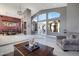 Open-concept living area with large windows, tile floors, and backyard access at 8540 E Mcdowell Rd # 10, Mesa, AZ 85207