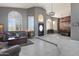 Spacious living room with tile flooring, comfortable seating and unique architectural details at 8540 E Mcdowell Rd # 10, Mesa, AZ 85207