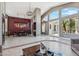 Open-concept living room with high ceilings, tile flooring, and access to the backyard at 8540 E Mcdowell Rd # 10, Mesa, AZ 85207