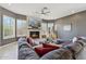 Comfortable living room boasts a fireplace with stone surround, recessed lighting, and plush seating at 8540 E Mcdowell Rd # 10, Mesa, AZ 85207