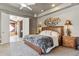 Relaxing main bedroom features a textured headboard, soft lighting, and ensuite bathroom access at 8540 E Mcdowell Rd # 10, Mesa, AZ 85207