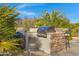 Built in stainless steel BBQ grill with outdoor kitchen area perfect for entertaining and dining alfresco at 8540 E Mcdowell Rd # 10, Mesa, AZ 85207