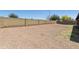 Spacious backyard with gravel, providing a low-maintenance outdoor space with block fencing at 8571 N 83Rd Dr, Peoria, AZ 85345