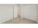 Bedroom with carpeted floors and double door closet at 8571 N 83Rd Dr, Peoria, AZ 85345