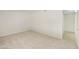 Bedroom featuring neutral carpeting with a doorway to another room at 8571 N 83Rd Dr, Peoria, AZ 85345