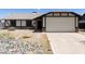 Charming single-story home with a neutral color scheme and a spacious two-car garage at 8571 N 83Rd Dr, Peoria, AZ 85345