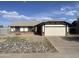 Charming single-story home with a two-car garage and low maintenance front yard at 8571 N 83Rd Dr, Peoria, AZ 85345
