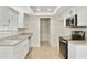 Modern kitchen with stainless steel appliances, ample cabinet space, and neutral countertops at 8571 N 83Rd Dr, Peoria, AZ 85345